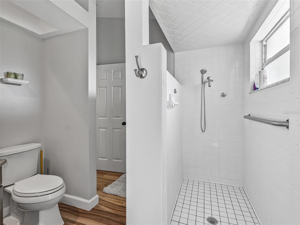 5714 Northwest 80th Ave Road Ocala, FL 34482 - Photo 29 of 39 a bathroom with a toilet and a shower