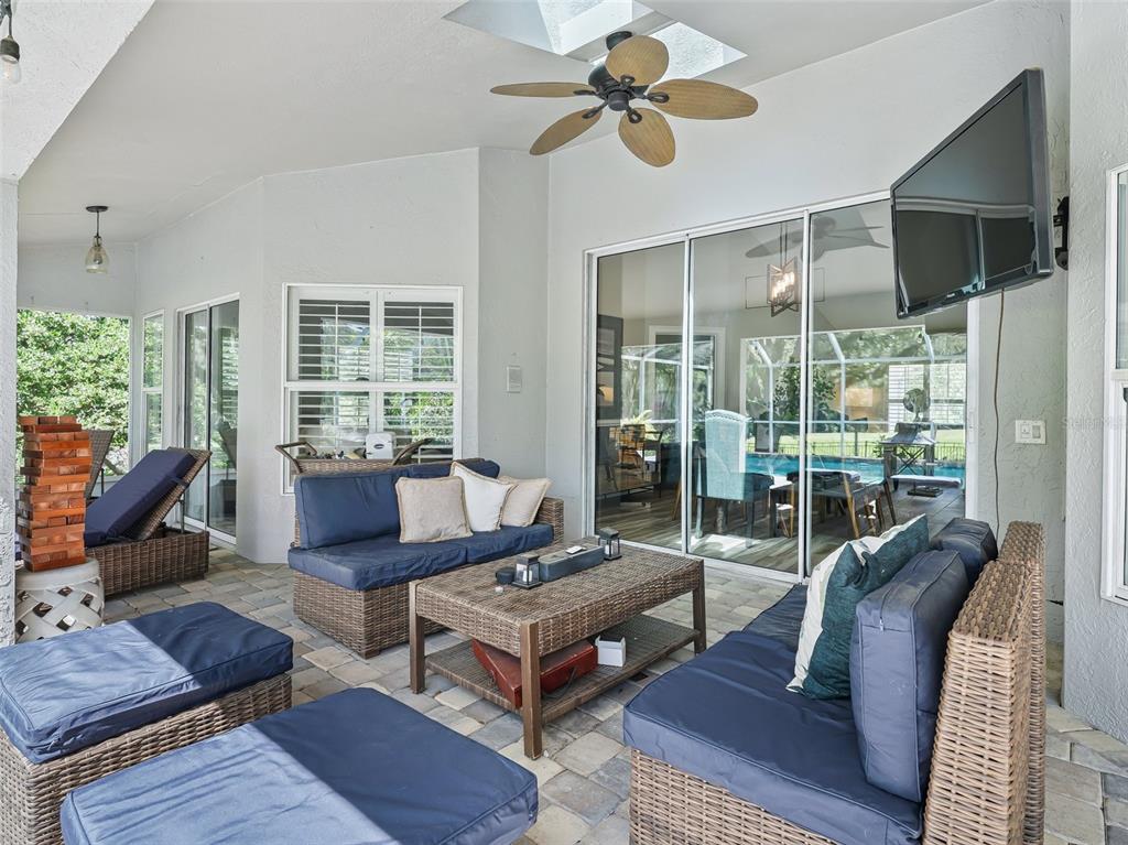 5714 Northwest 80th Ave Road Ocala, FL 34482 - Photo 31 of 39 a living room with furniture potted plant and a large window