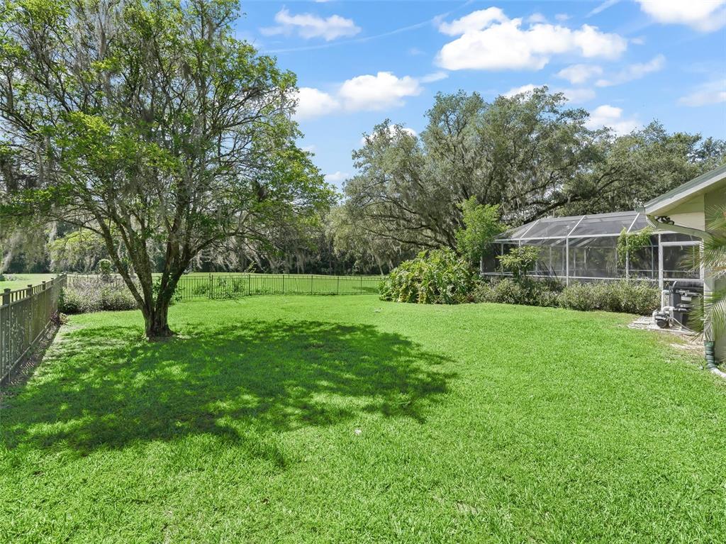 5714 Northwest 80th Ave Road Ocala, FL 34482 - Photo 35 of 39 a view of a backyard with a garden