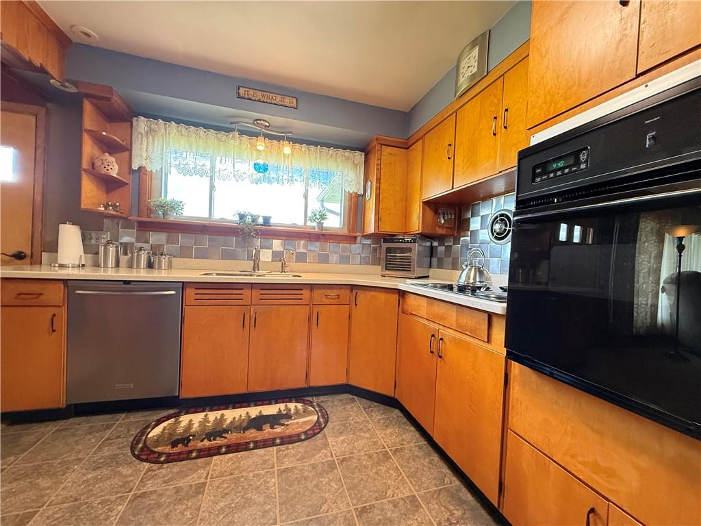 3344 Perry Highway Hadley, PA 16130 - Photo 35 of 50 a kitchen with a sink stove and cabinets
