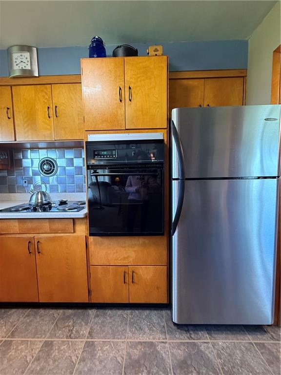 3344 Perry Highway Hadley, PA 16130 - Photo 36 of 50 a white refrigerator freezer sitting in a kitchen