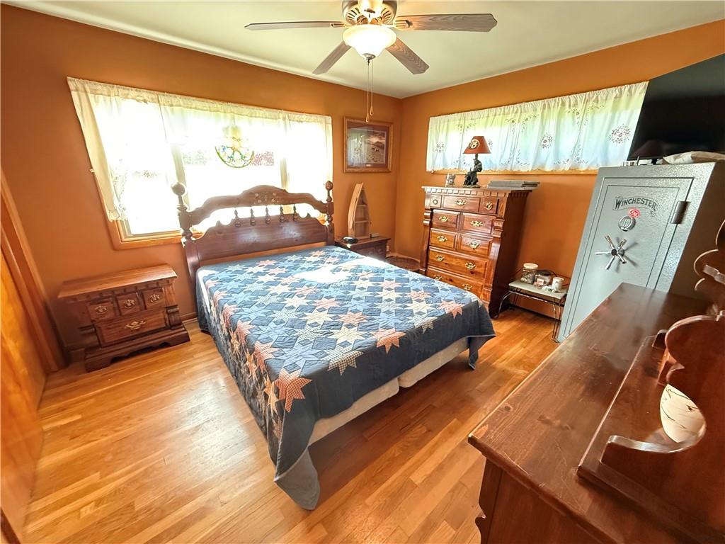 3344 Perry Highway Hadley, PA 16130 - Photo 40 of 50 a bed sitting in a room next to a window