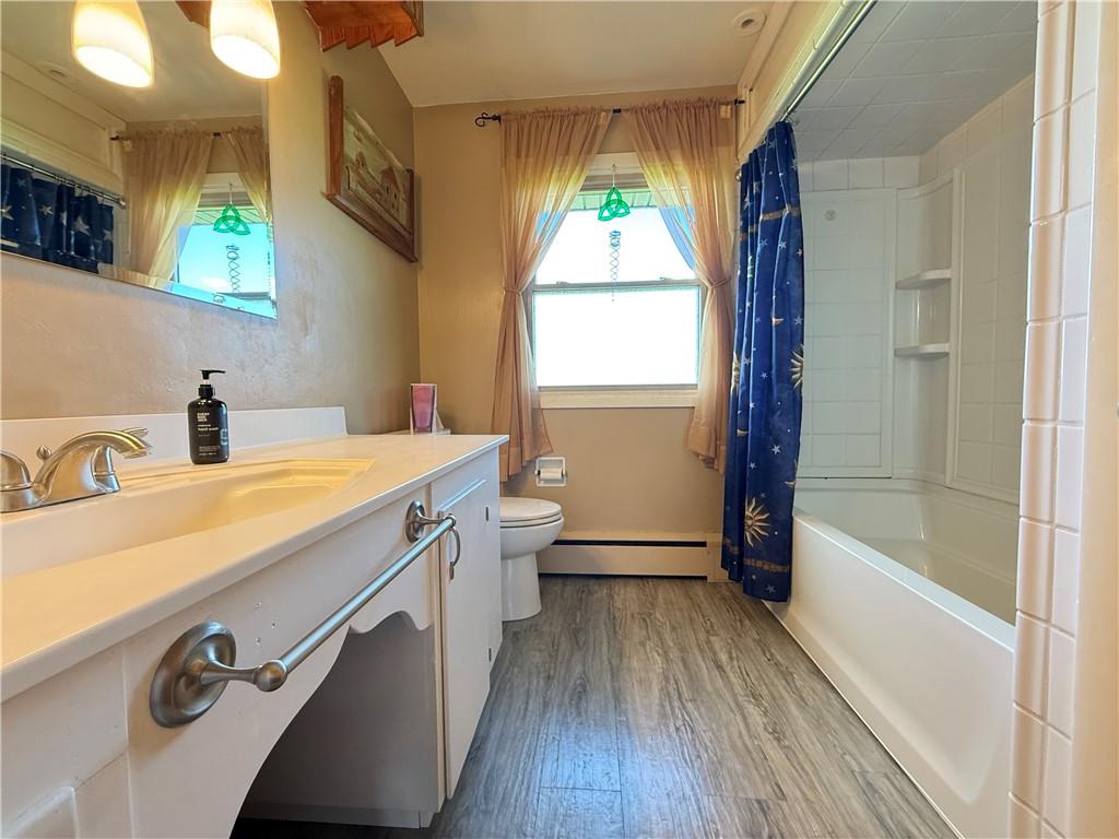 3344 Perry Highway Hadley, PA 16130 - Photo 43 of 50 a bathroom with a sink a mirror and a bathtub