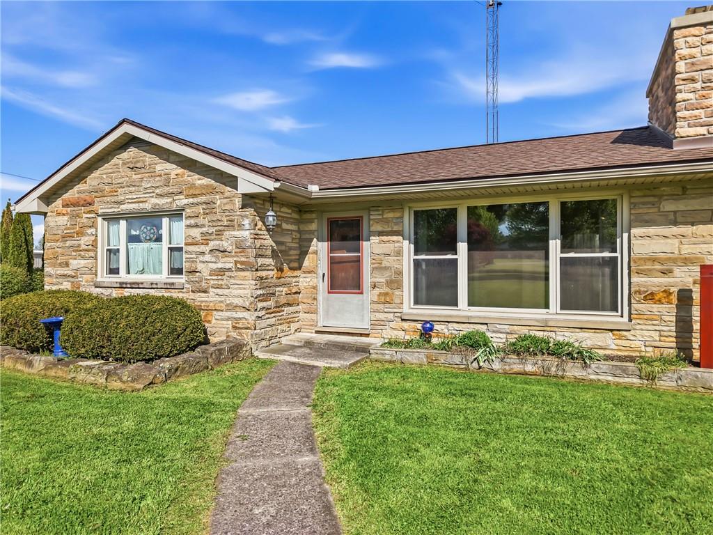 3344 Perry Highway Hadley, PA 16130 - Photo 5 of 50 a front view of a house with a yard