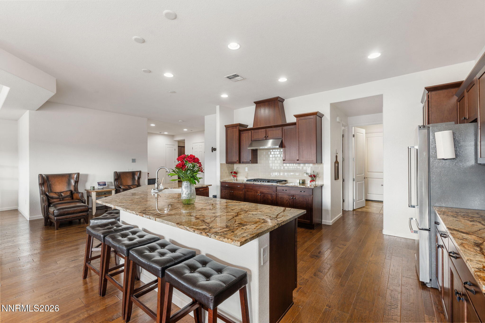 9811 Dyevera Lane Reno, NV 89521 - Photo 11 of 32 a kitchen with a table and chairs in it