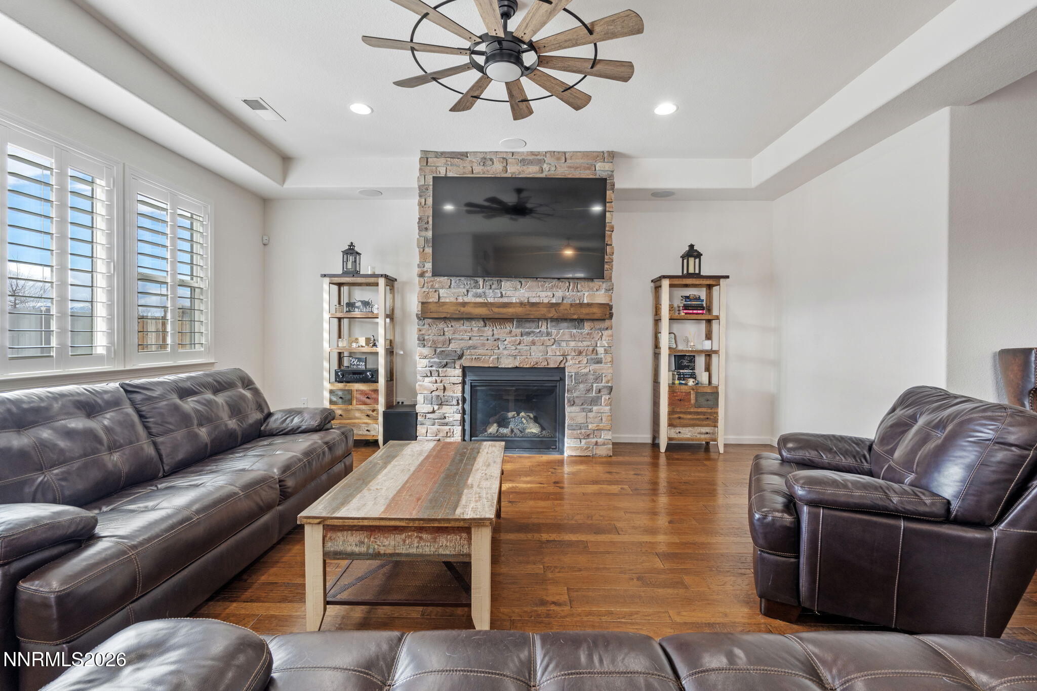 9811 Dyevera Lane Reno, NV 89521 - Photo 15 of 32 a living room with furniture and a fireplace