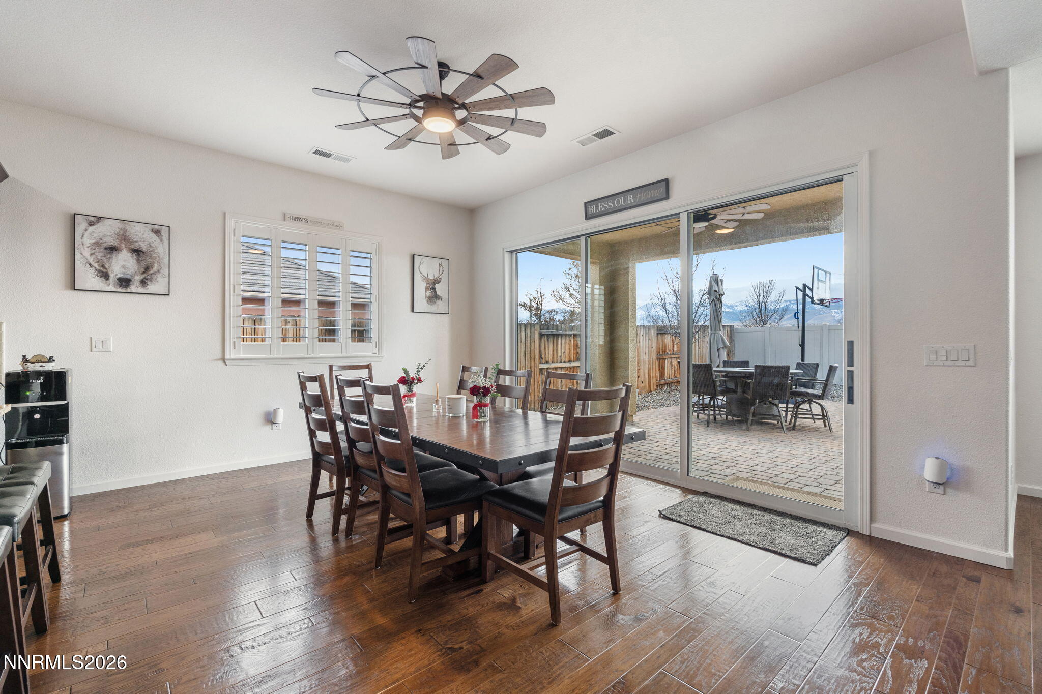 9811 Dyevera Lane Reno, NV 89521 - Photo 17 of 32 a view of a dining room with furniture window and wooden floor