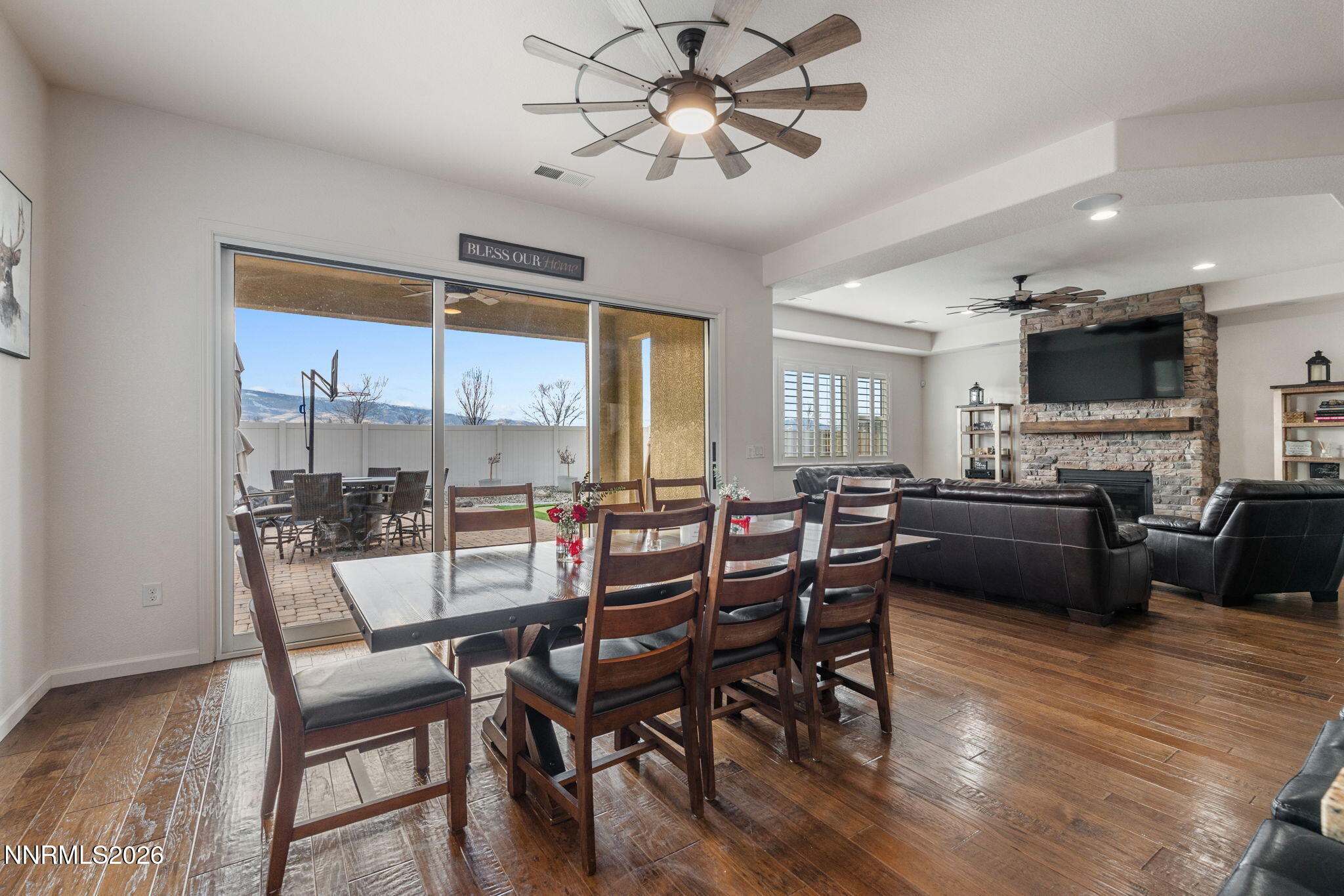 9811 Dyevera Lane Reno, NV 89521 - Photo 18 of 32 a view of a dining room with furniture window and wooden floor