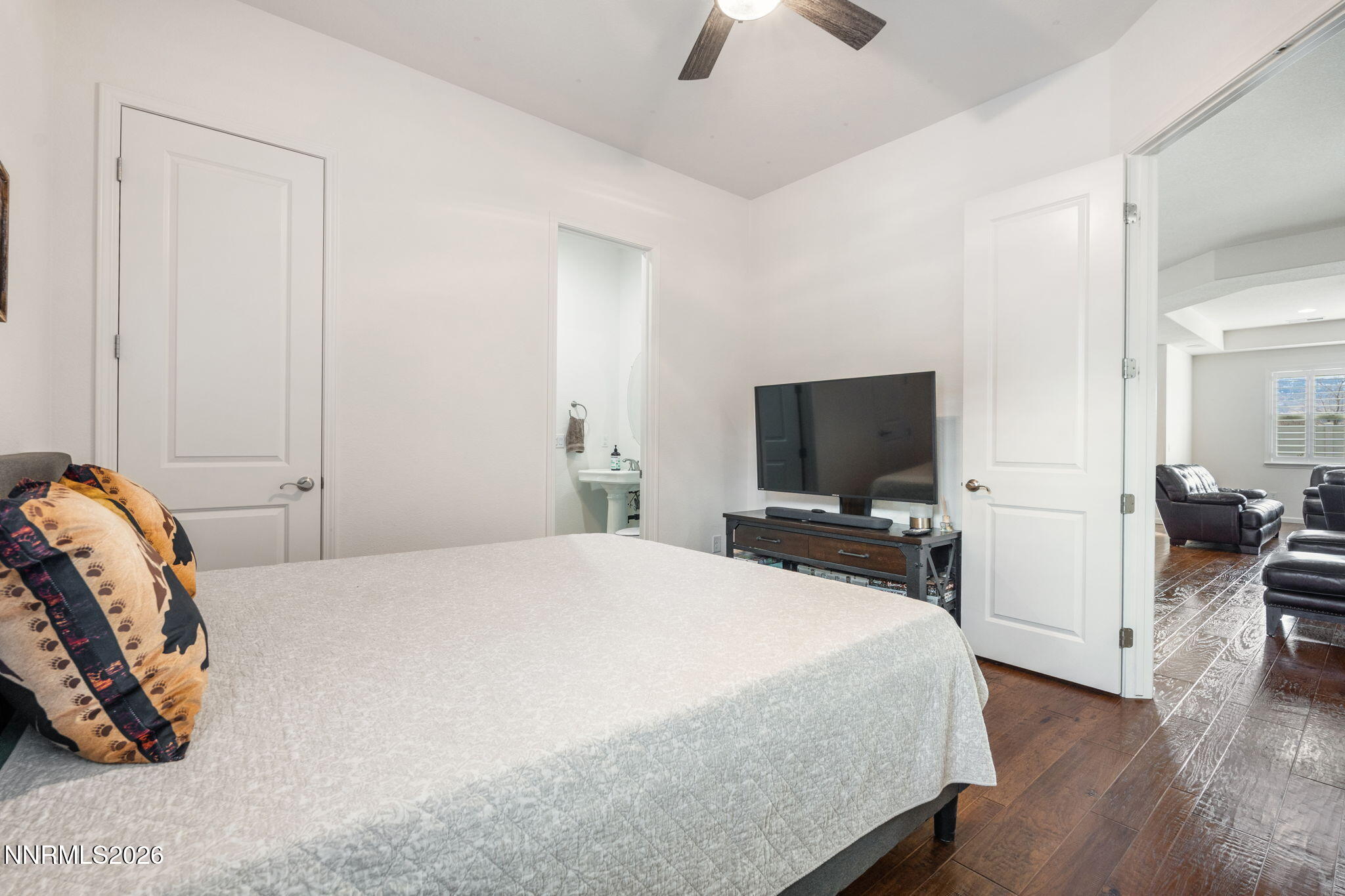 9811 Dyevera Lane Reno, NV 89521 - Photo 20 of 32 a bedroom with a bed and a flat screen tv