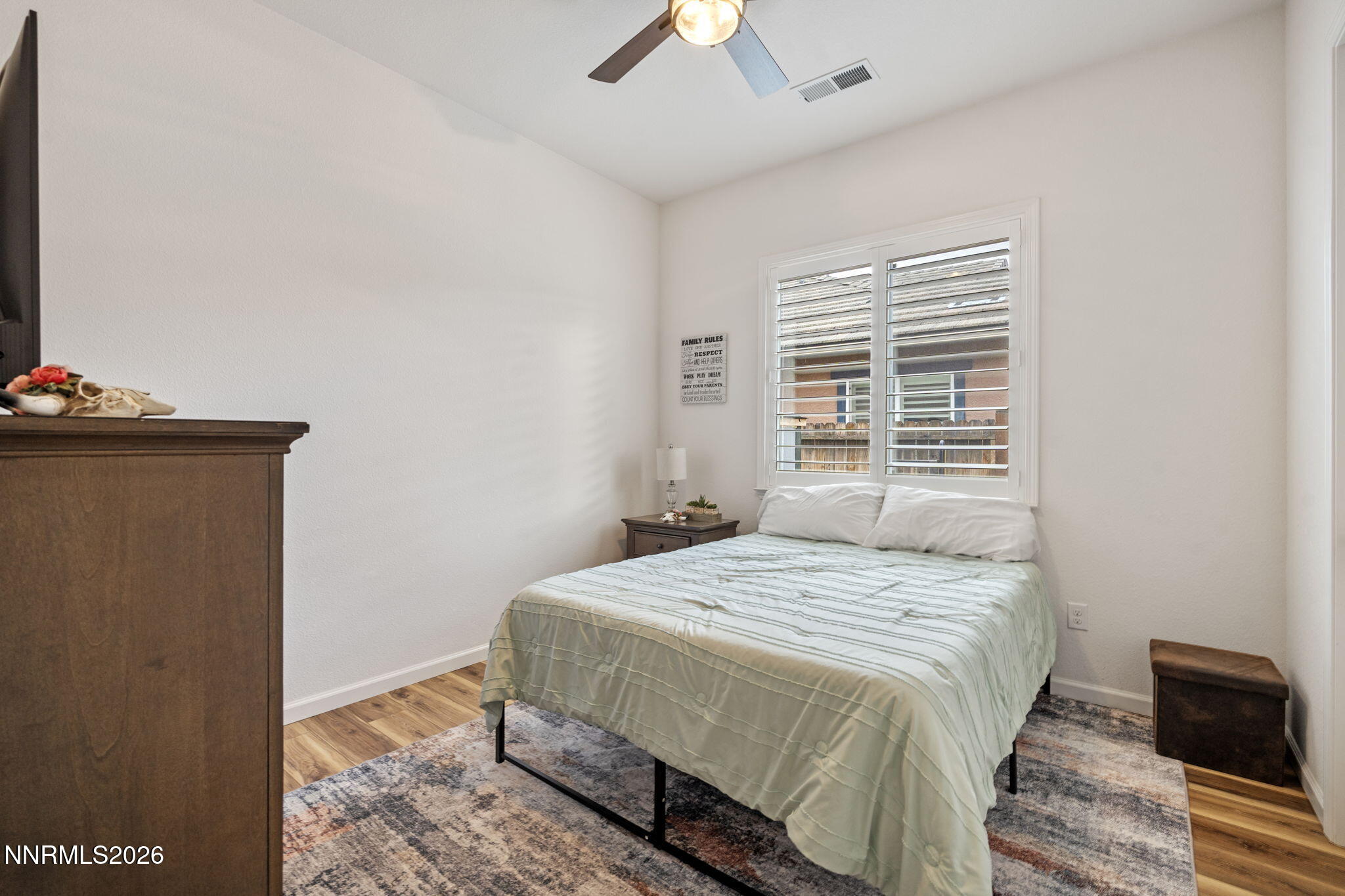 9811 Dyevera Lane Reno, NV 89521 - Photo 22 of 32 a bedroom with a bed and a window
