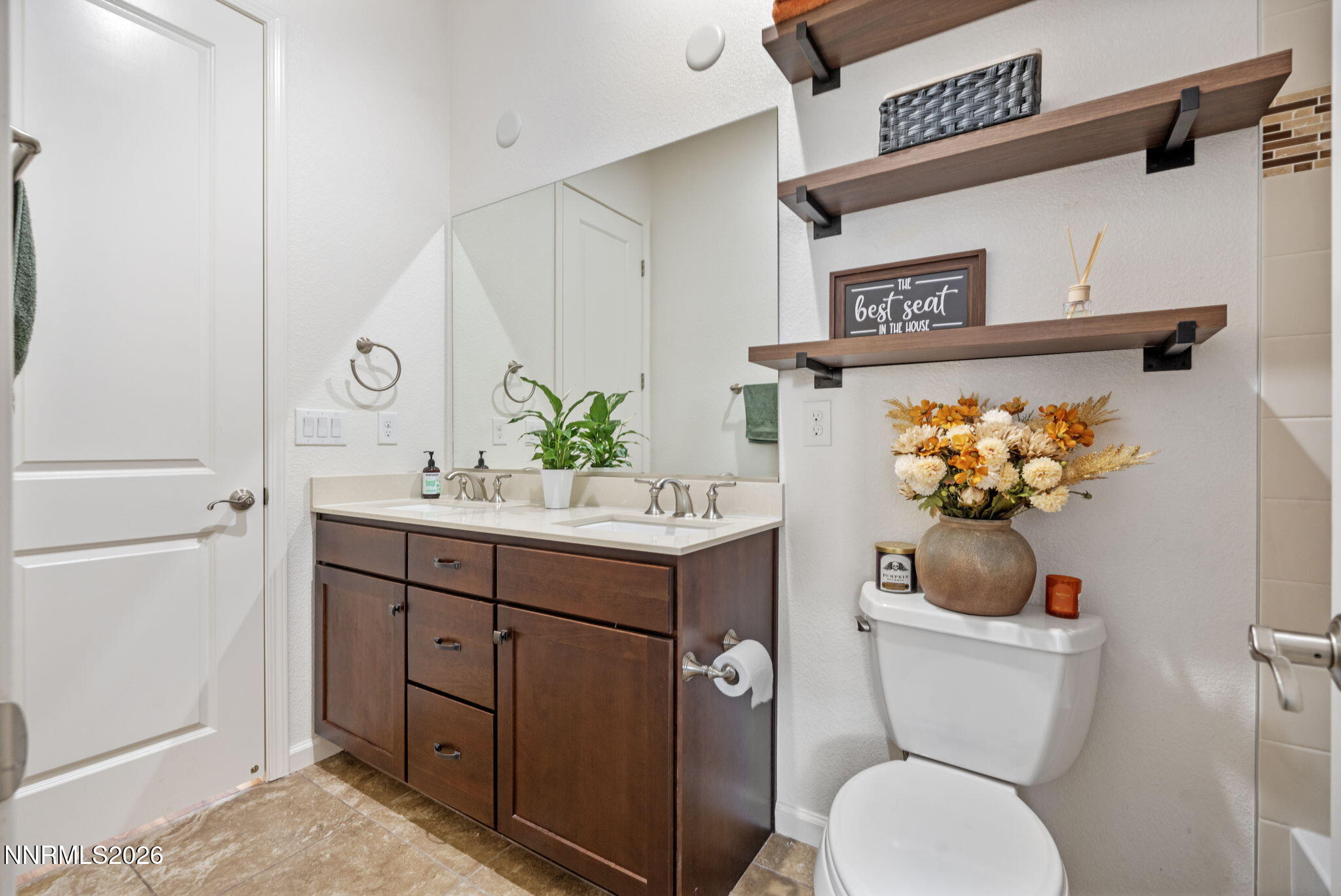 9811 Dyevera Lane Reno, NV 89521 - Photo 23 of 32 a bathroom with a toilet sink and mirror