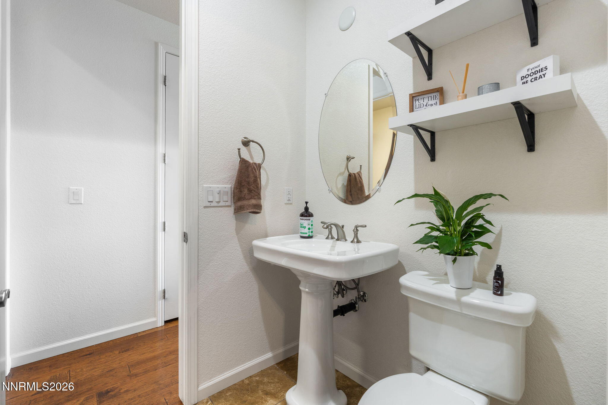 9811 Dyevera Lane Reno, NV 89521 - Photo 24 of 32 a bathroom with a toilet sink and mirror