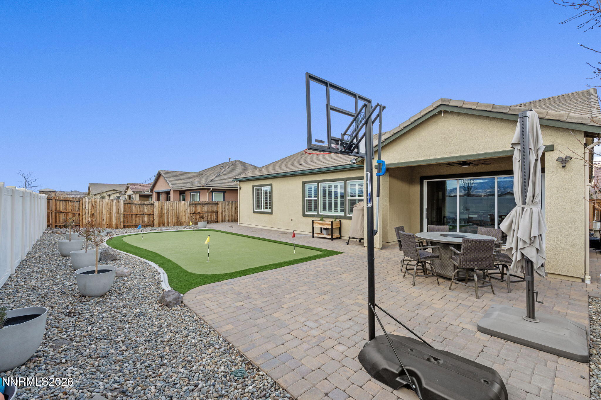 9811 Dyevera Lane Reno, NV 89521 - Photo 26 of 32 a front view of a house with garden