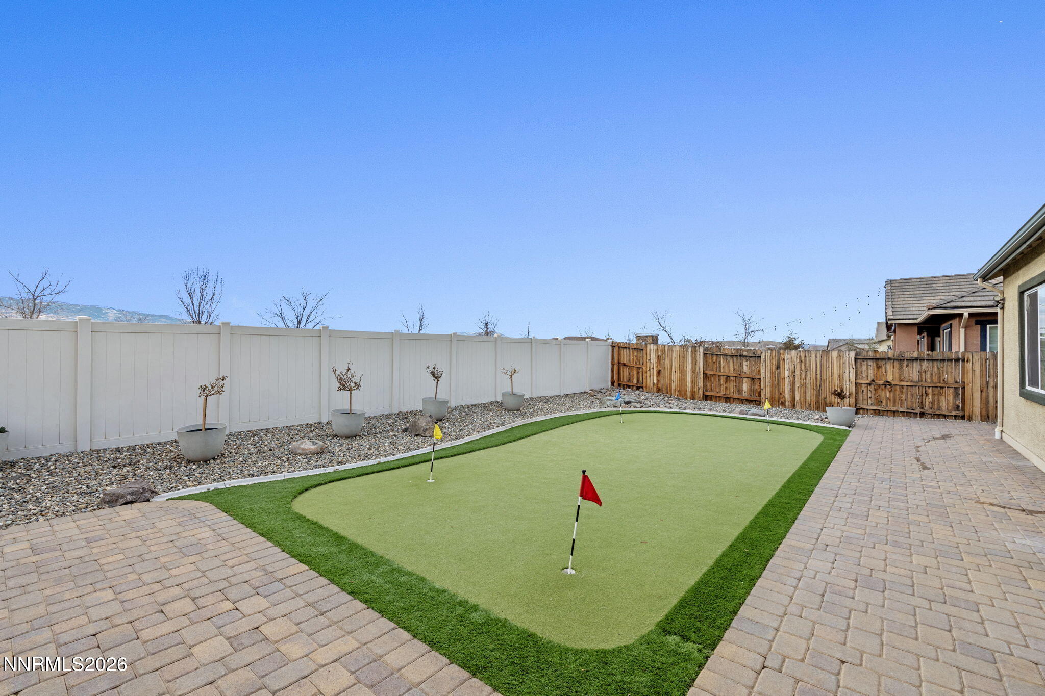 9811 Dyevera Lane Reno, NV 89521 - Photo 27 of 32 a view of a swimming pool with a yard