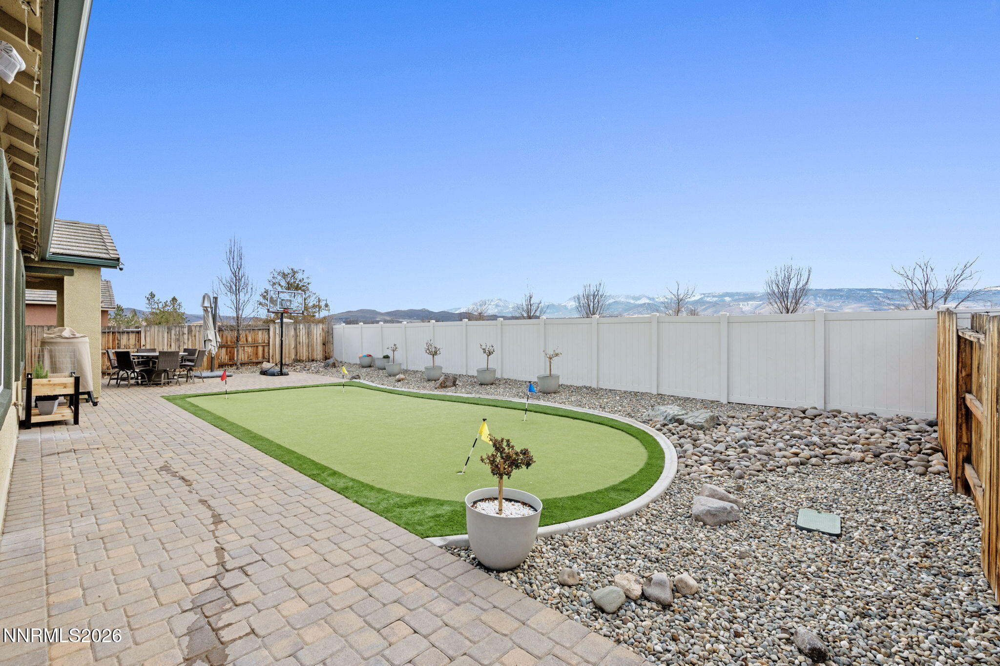 9811 Dyevera Lane Reno, NV 89521 - Photo 31 of 32 a view of a swimming pool with a lounge chair