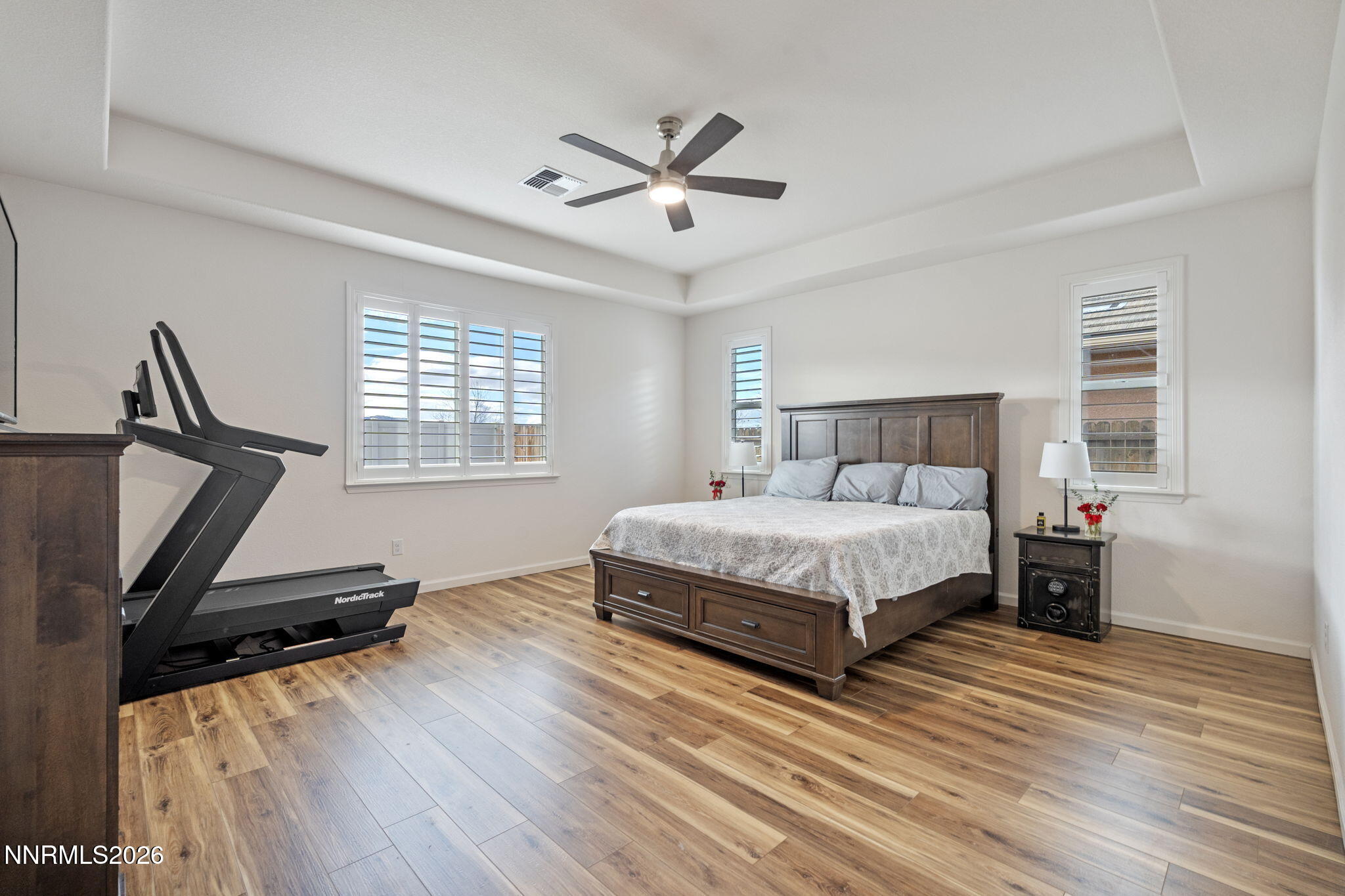 9811 Dyevera Lane Reno, NV 89521 - Photo 4 of 32 a bedroom with a bed window and a flat screen tv