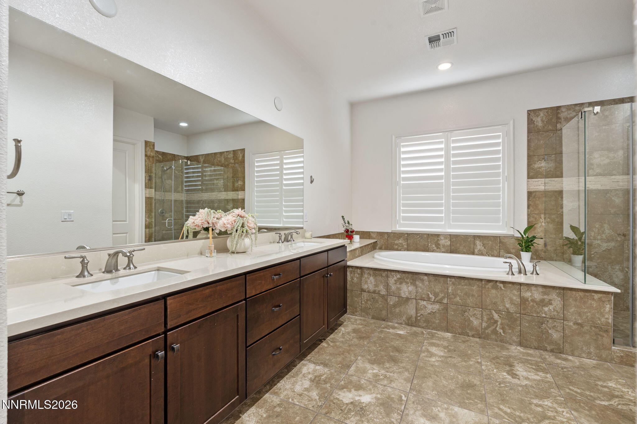 9811 Dyevera Lane Reno, NV 89521 - Photo 6 of 32 a bathroom with a large tub sink and double vanity