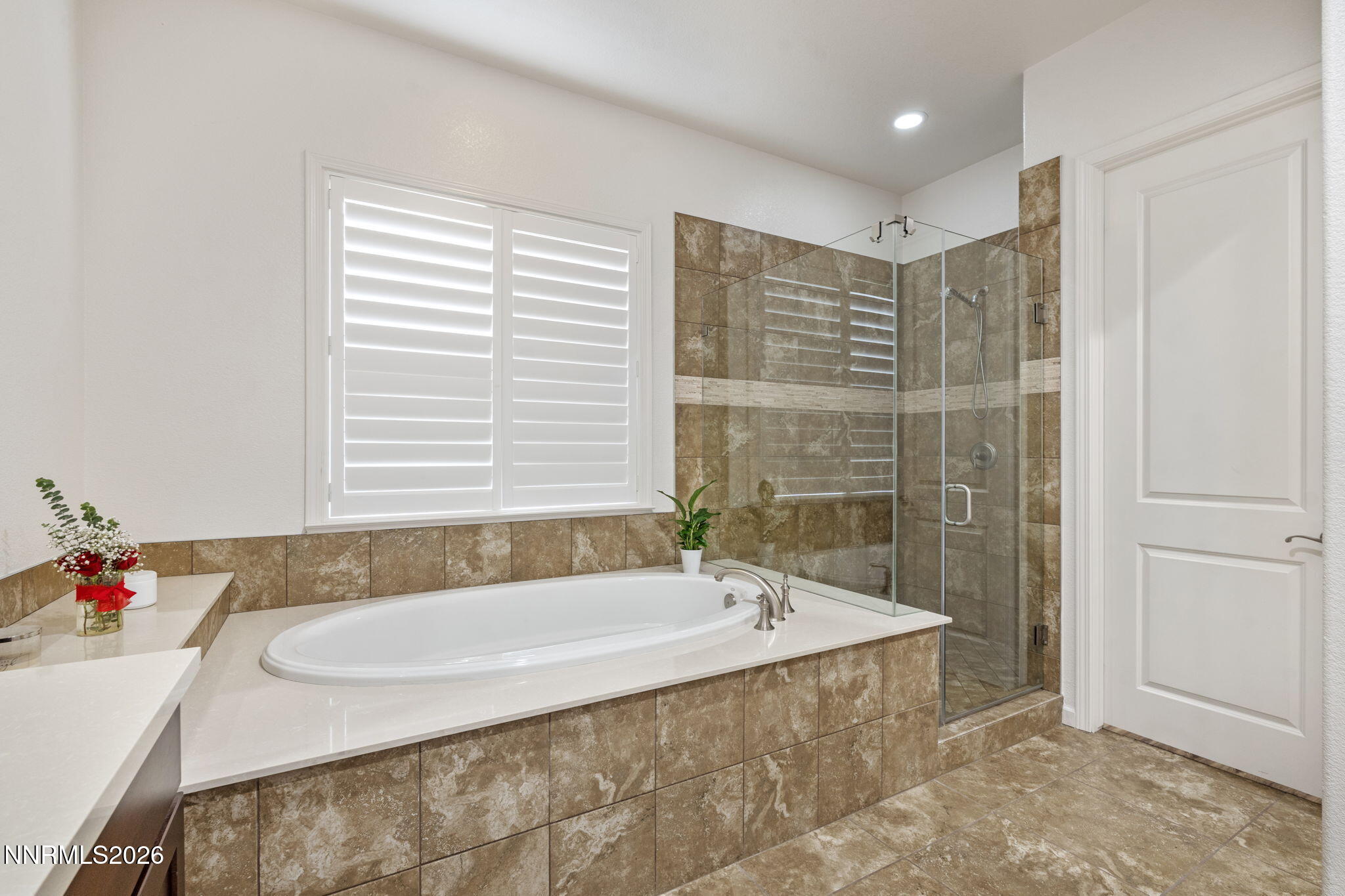 9811 Dyevera Lane Reno, NV 89521 - Photo 7 of 32 a bathroom with a granite countertop tub and a sink