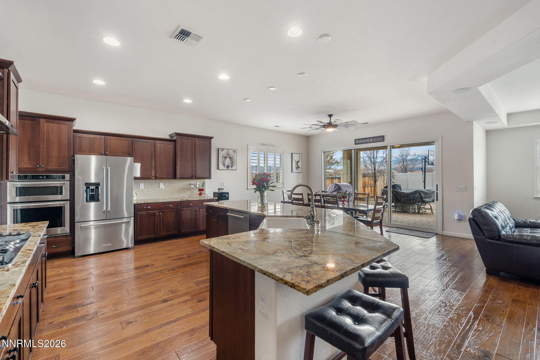 9811 Dyevera Lane Reno, NV 89521 - Photo 9 of 32 a large kitchen with a table and chairs