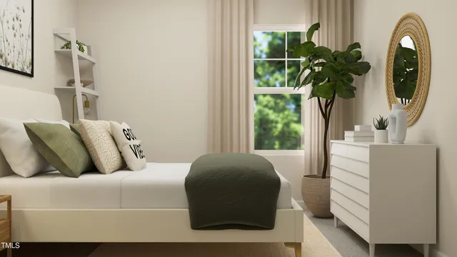 a living room with a couch and a potted plant