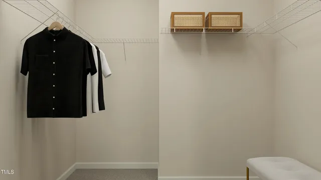 a bathroom with a toilet and a mirror