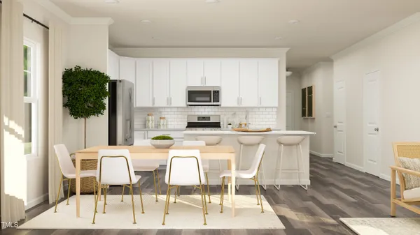 a kitchen with stainless steel appliances kitchen island granite countertop a refrigerator a stove a microwave oven a dining table and chairs with wooden floor