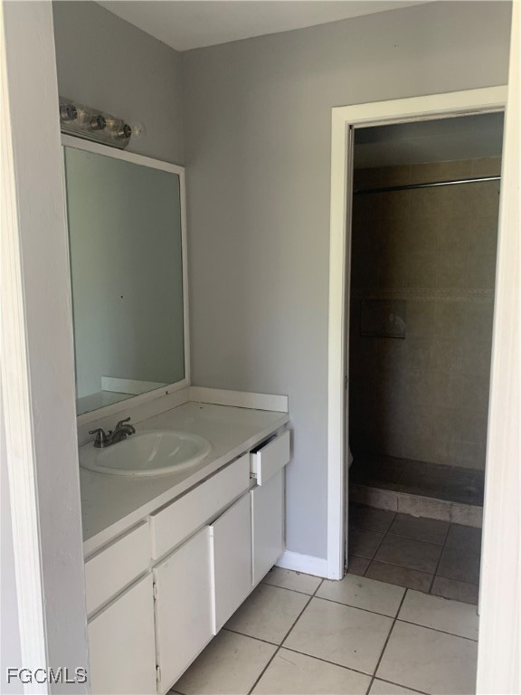 650 Creuset Avenue South Lehigh Acres, FL 33974 - Photo 11 of 15 a bathroom with a granite countertop sink and mirror