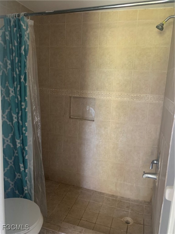 650 Creuset Avenue South Lehigh Acres, FL 33974 - Photo 12 of 15 a bathroom with a shower