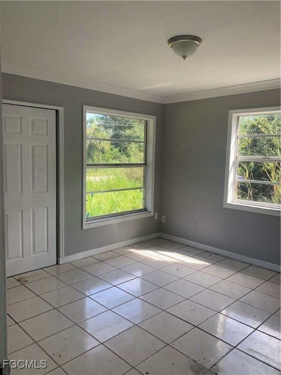 650 Creuset Avenue South Lehigh Acres, FL 33974 - Photo 14 of 15 a view of an empty room with a window