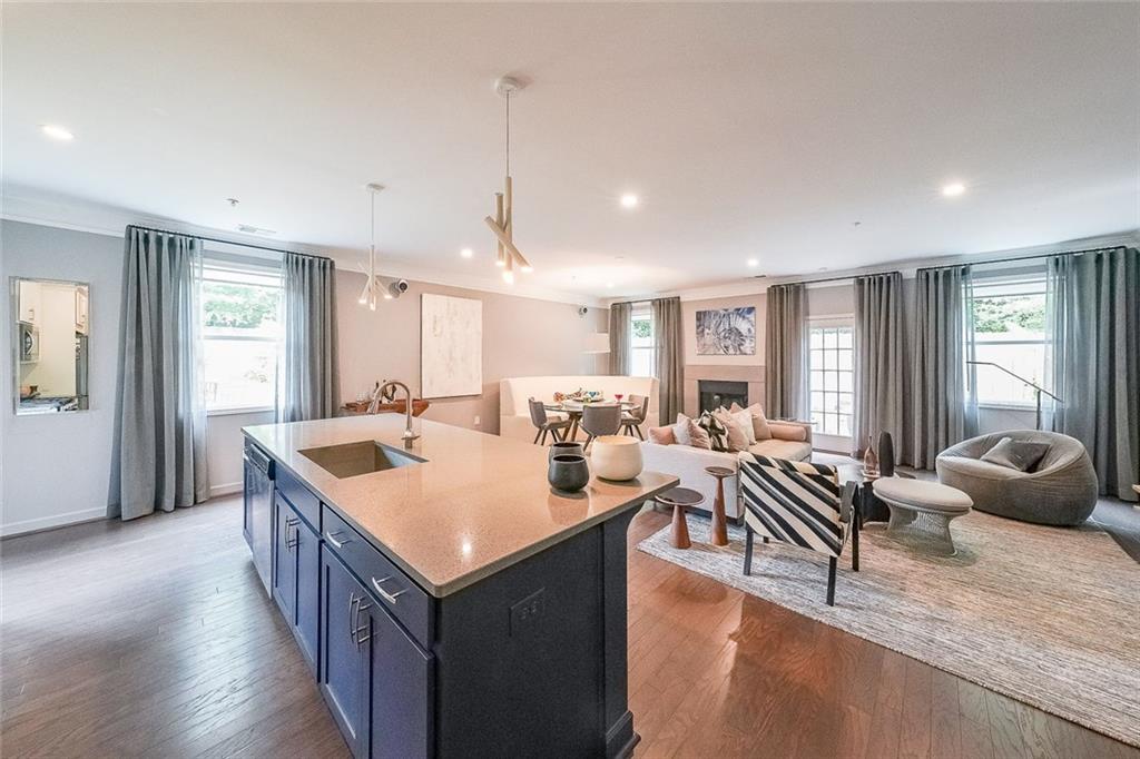 1024 Rohner Way Smyrna, GA 30080 - Photo 2 of 17 a living room with stainless steel appliances granite countertop a living room and couches with wooden floor