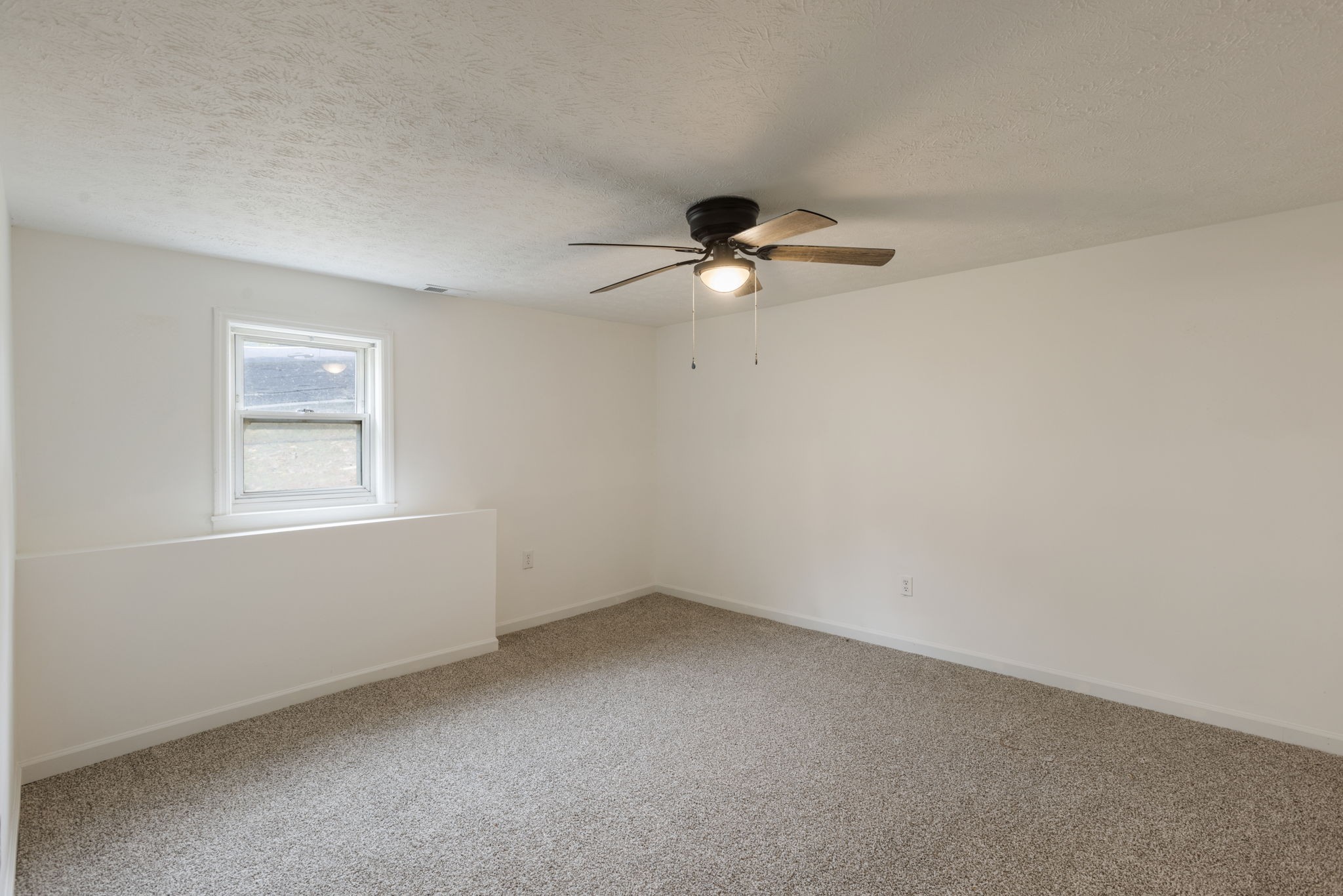 415 Durrett Street Springfield, TN 37172 - Photo 39 of 54 an empty room with a window and a fan