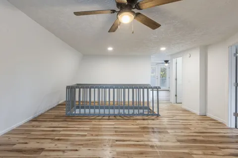 a view of a livingroom with wooden floor