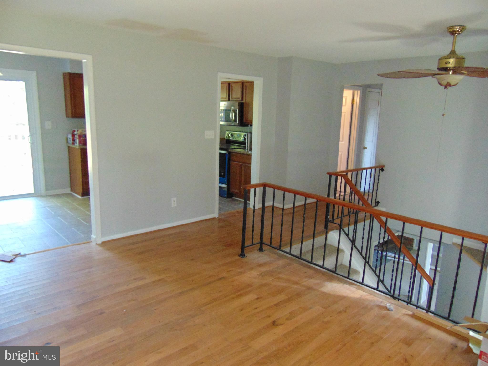 3706 Altondale Road Reisterstown, MD 21136 - Photo 8 of 27 a view of a hallway with wooden floor and stairs