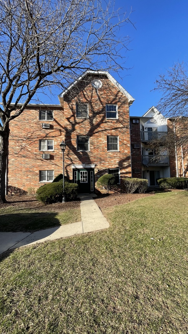 4301 West Shamrock Lane, Unit 2D McHenry, IL 60050 - Photo 18 of 18 a view of a street with cars