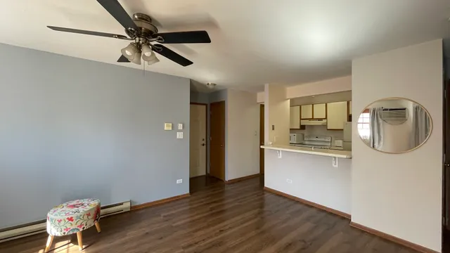 a view of kitchen with sink and wooden floor