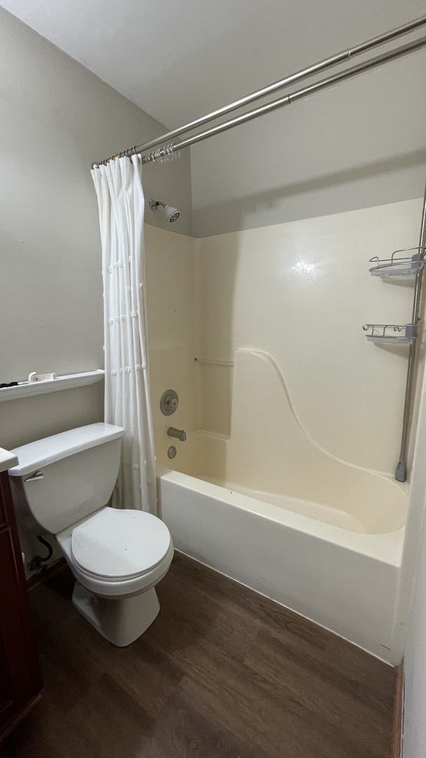 4301 West Shamrock Lane, Unit 2D McHenry, IL 60050 - Photo 6 of 18 a bathroom with a toilet and a bath tub