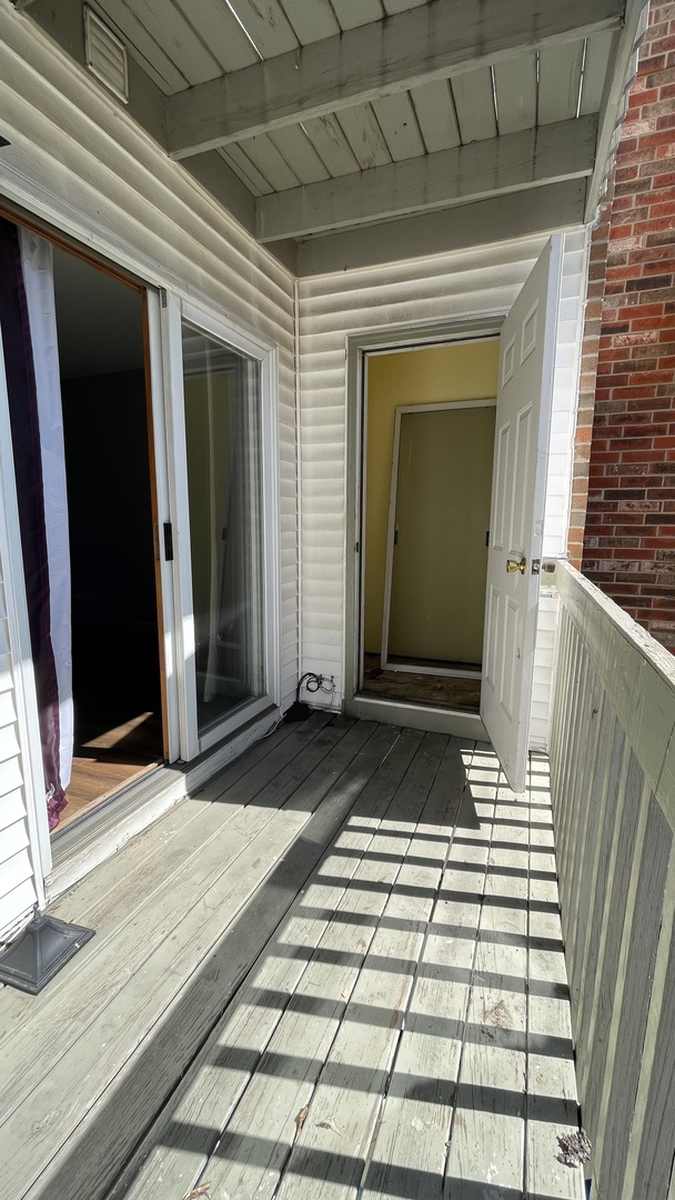 4301 West Shamrock Lane, Unit 2D McHenry, IL 60050 - Photo 9 of 18 a view of a brick house with a door