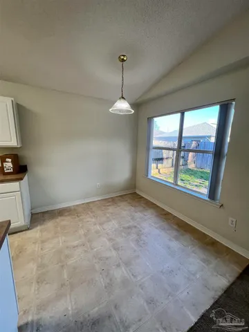 a view of a room with windows