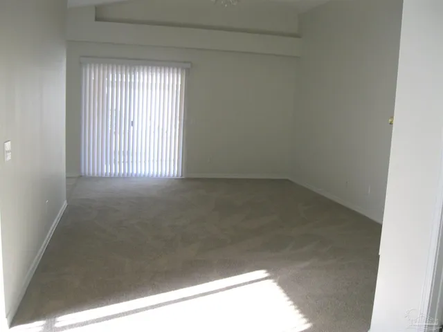 a view of an empty room and window