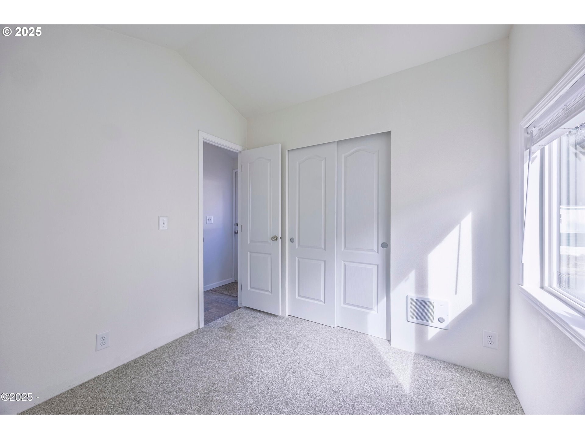 4875 Highway 101, Unit 96 Depoe Bay, OR 97341 - Photo 11 of 18 a view of an empty room with a window