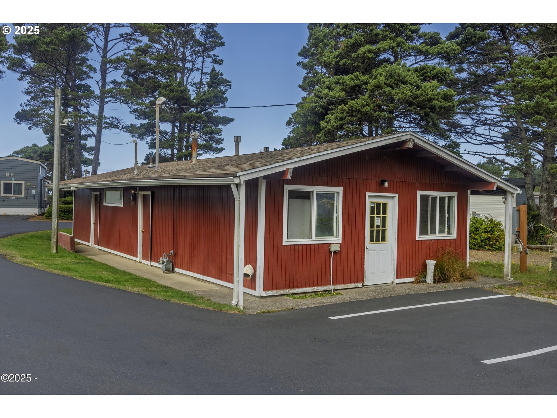 4875 Highway 101, Unit 96 Depoe Bay, OR 97341 - Photo 15 of 18 a front view of a house with a yard