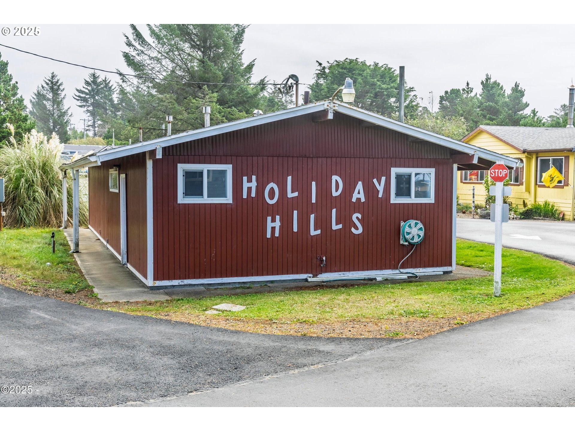 4875 Highway 101, Unit 96 Depoe Bay, OR 97341 - Photo 16 of 18 a view of a house with a yard