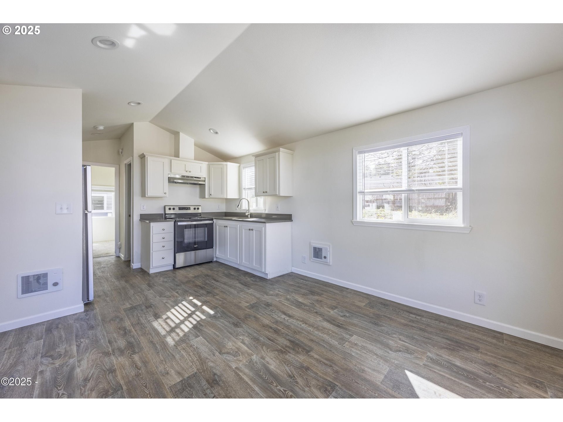 4875 Highway 101, Unit 96 Depoe Bay, OR 97341 - Photo 3 of 18 a view of kitchen with wooden floor