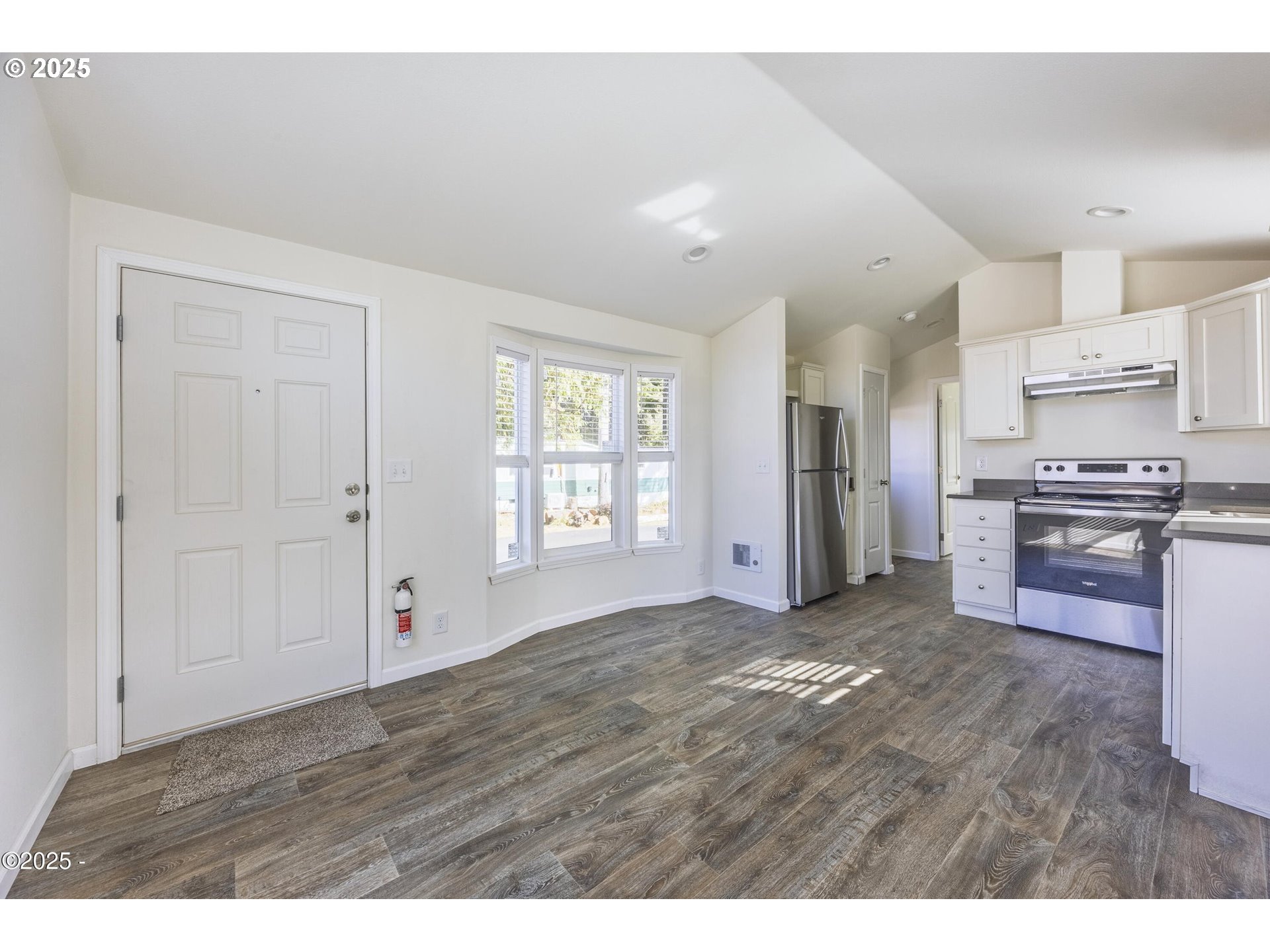 4875 Highway 101, Unit 96 Depoe Bay, OR 97341 - Photo 5 of 18 a view of kitchen with refrigerator and window