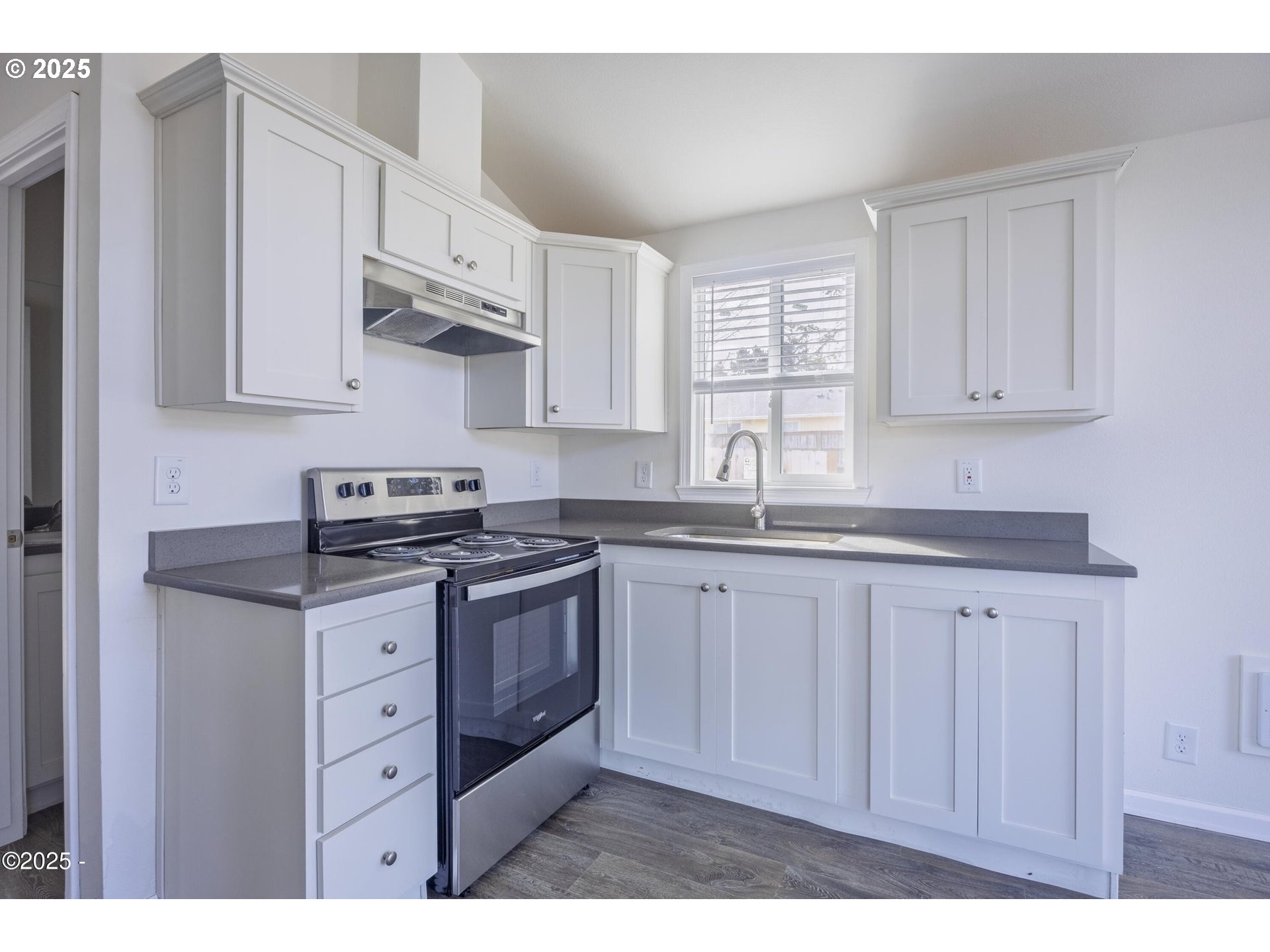 4875 Highway 101, Unit 96 Depoe Bay, OR 97341 - Photo 7 of 18 a kitchen with stainless steel appliances granite countertop a sink stove and cabinets