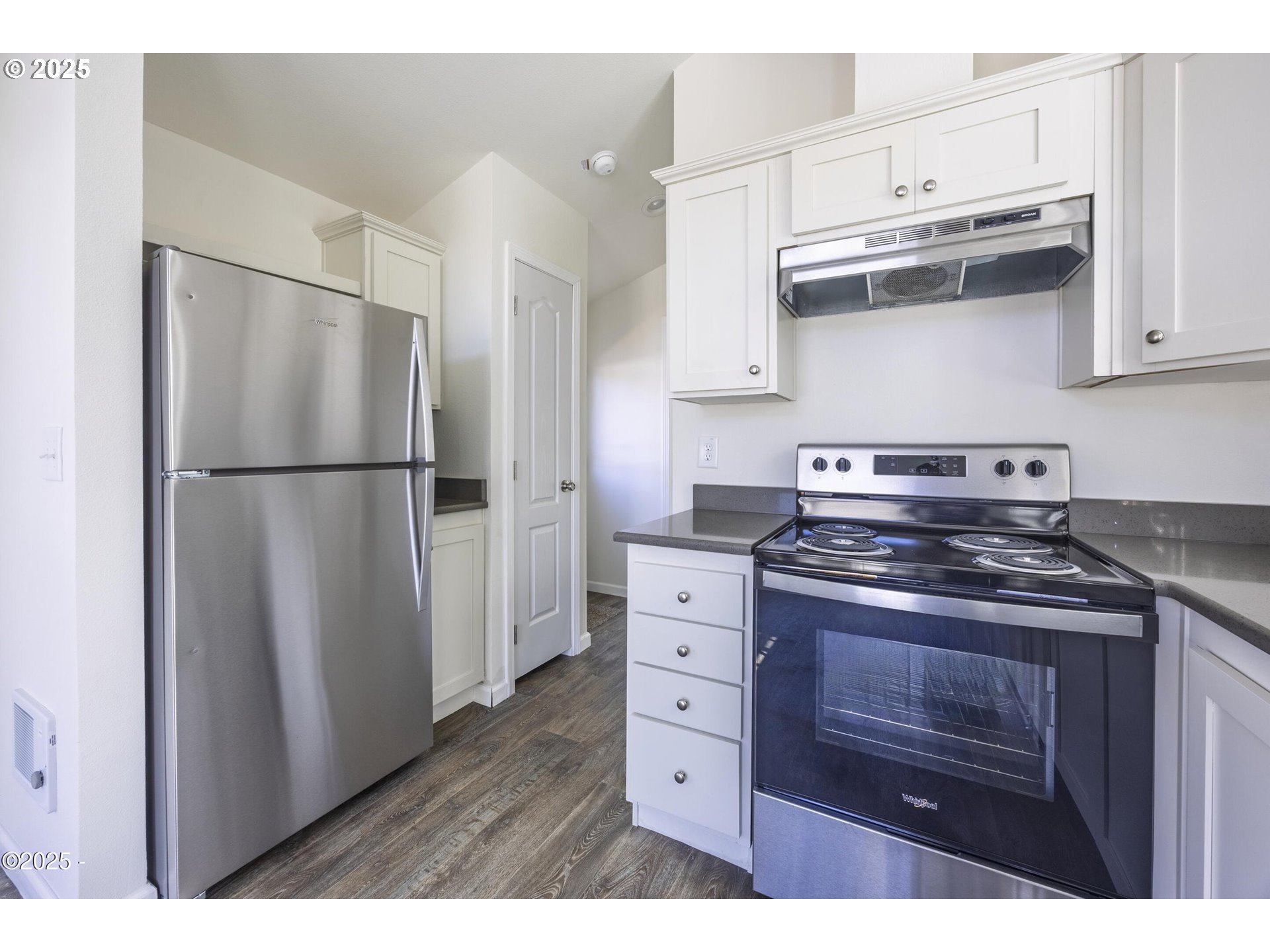 4875 Highway 101, Unit 96 Depoe Bay, OR 97341 - Photo 8 of 18 a kitchen with stainless steel appliances granite countertop a refrigerator stove and sink