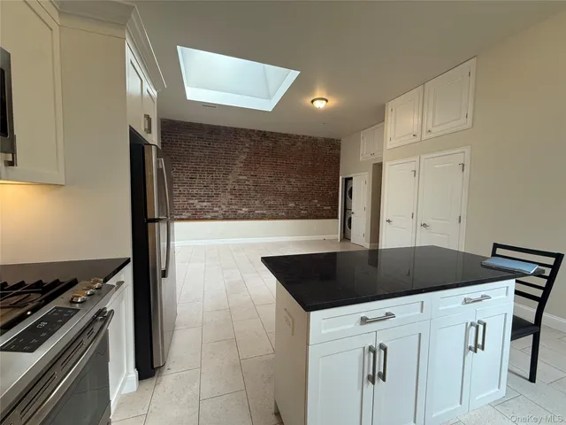 a view of an empty room with a fireplace