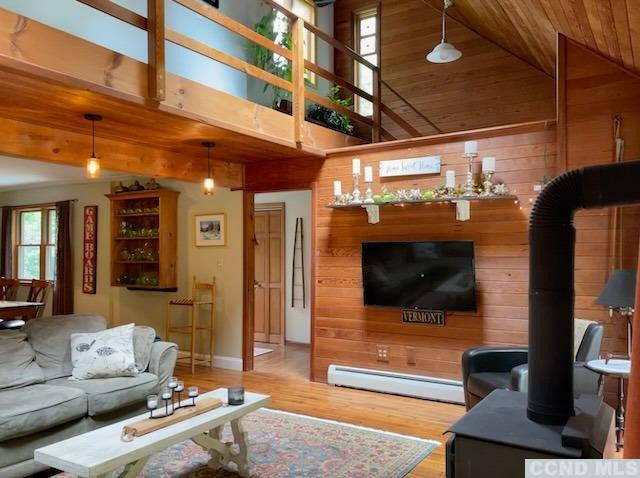 1325 County Rte 27 Craryville, NY 12521 - Photo 18 of 35 a living room with furniture and a flat screen tv