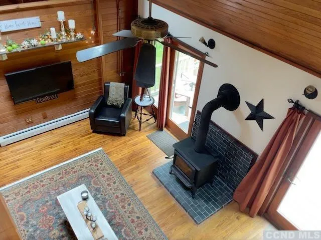 a living room with furniture rug and a fireplace