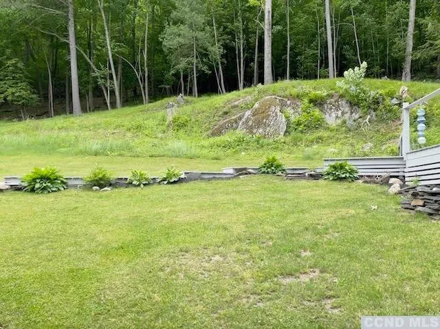 a garden with trees in front of it